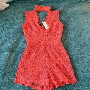 Never worn Bebe coral romper